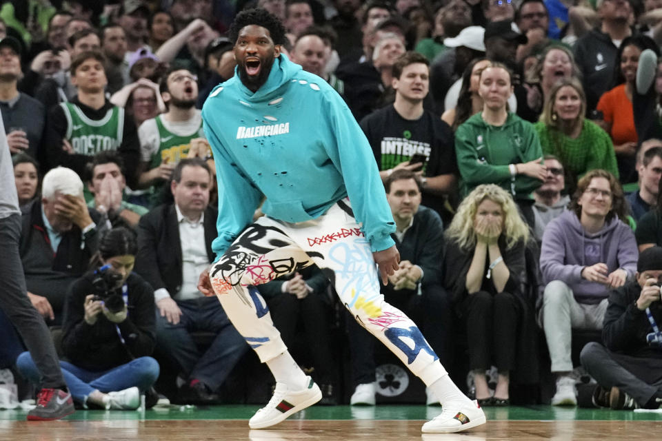 Joel Embiid cheered on his 76ers teammates while in street clothes Monday. (AP Photo/Charles Krupa)