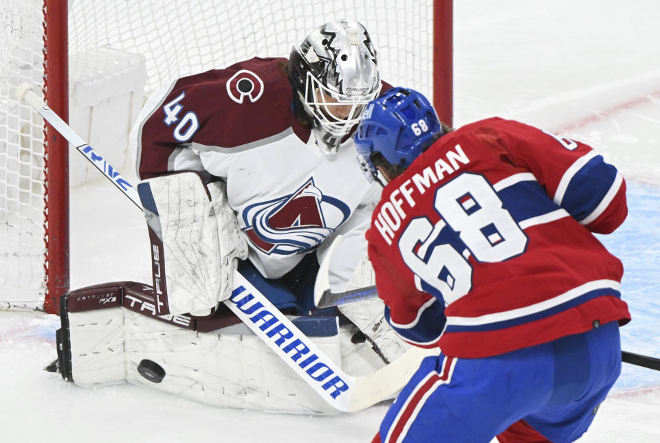 Montreal Canadiens' Mike Hoffman (68) is stopped by Colorado Avalanche goaltender Alexandar Georgiev during first-period NHL hockey game action in Montreal, Monday, March 13, 2023. (Graham Hughes/The Canadian Press via AP)