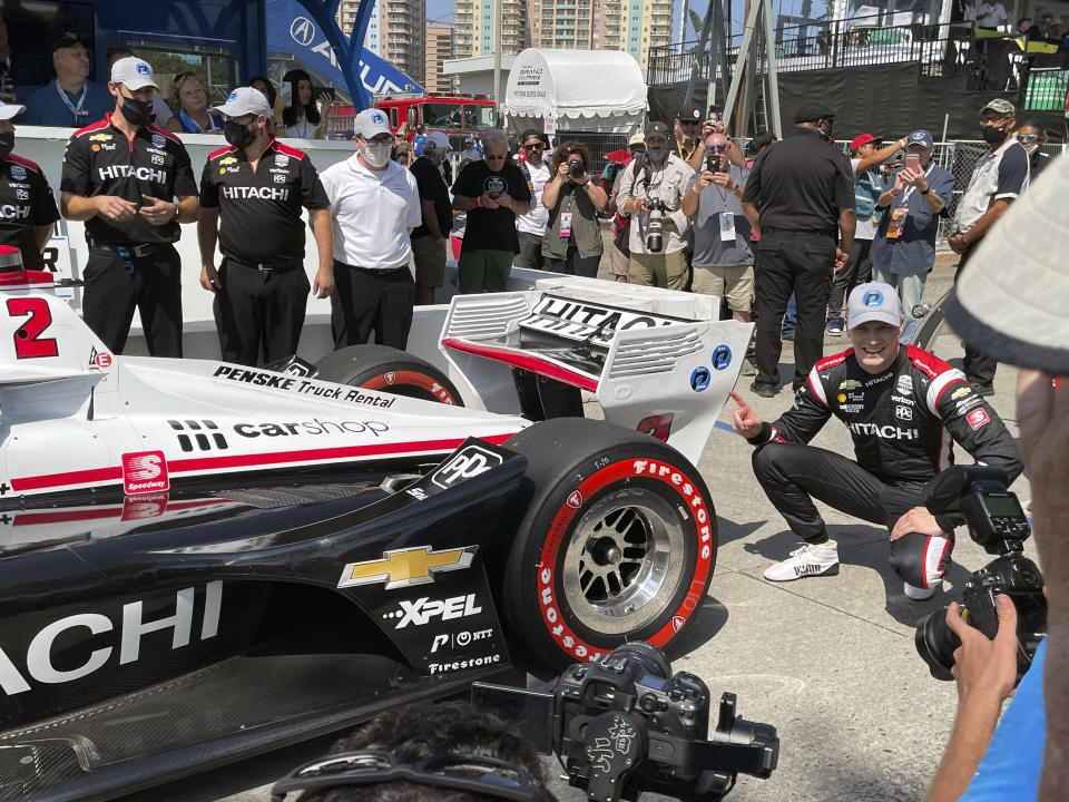 American driver Josef Newgarden celebrates after winning the pole for the Grand Prix of Long Beach, Saturday, Sept. 25, 2021, in Long Beach, Calif. The Sunday race on the downtown street circuit will crown the IndyCar champion and Newgarden sits third in the standings, behind leader Alex Palou of Spain and Pato O'Ward of Mexico. (AP Photo/Jenna Fryer)