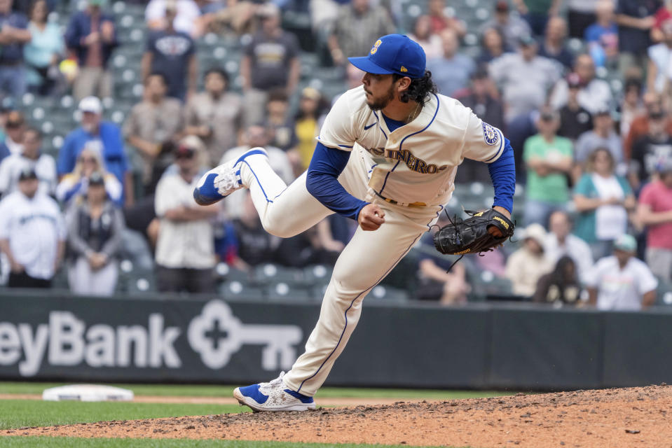 Seattle Mariners reliever Andres Munoz watches a throw during the ninth inning of the team's baseball game against the San Diego Padres, Wednesday, Sept. 14, 2022, in Seattle. The Mariners won 6-1. (AP Photo/Stephen Brashear)