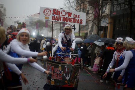 Carnival participants march during a parade in Torres Vedras, Portugal February 11, 2018. REUTERS/Pedro Nunes