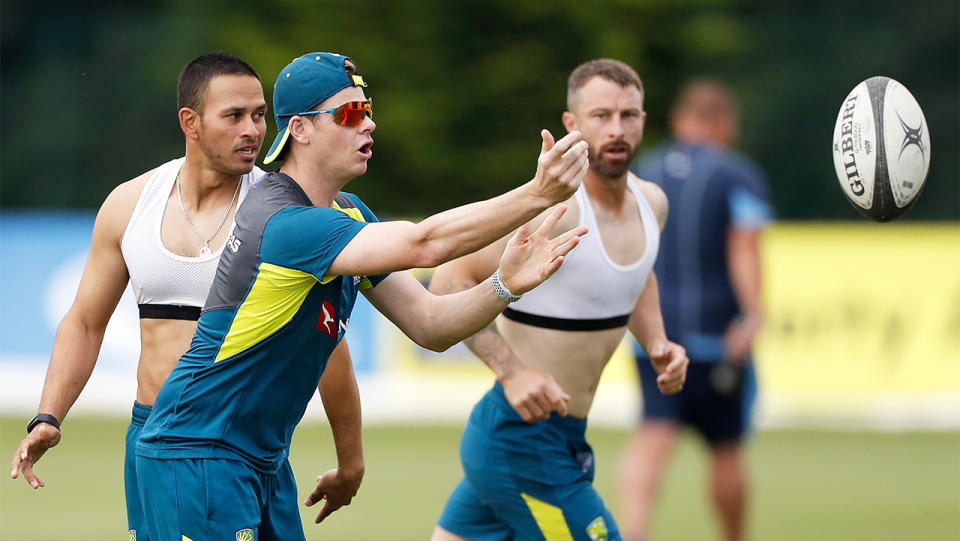 Steve Smith throws a cut-out pass during a Touch Rugby game.