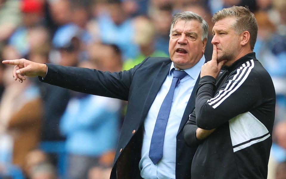 Sam Allardyce, manager of Leeds United, speaks with coach Karl Robinson