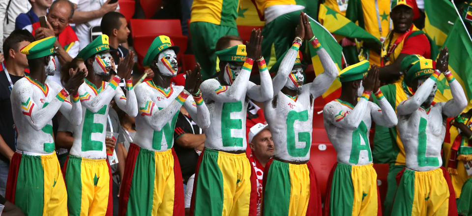 <p>Senegal fans made a huge effort with this coordinated offering. Just make sure you always sit in that order… (Getty) </p>