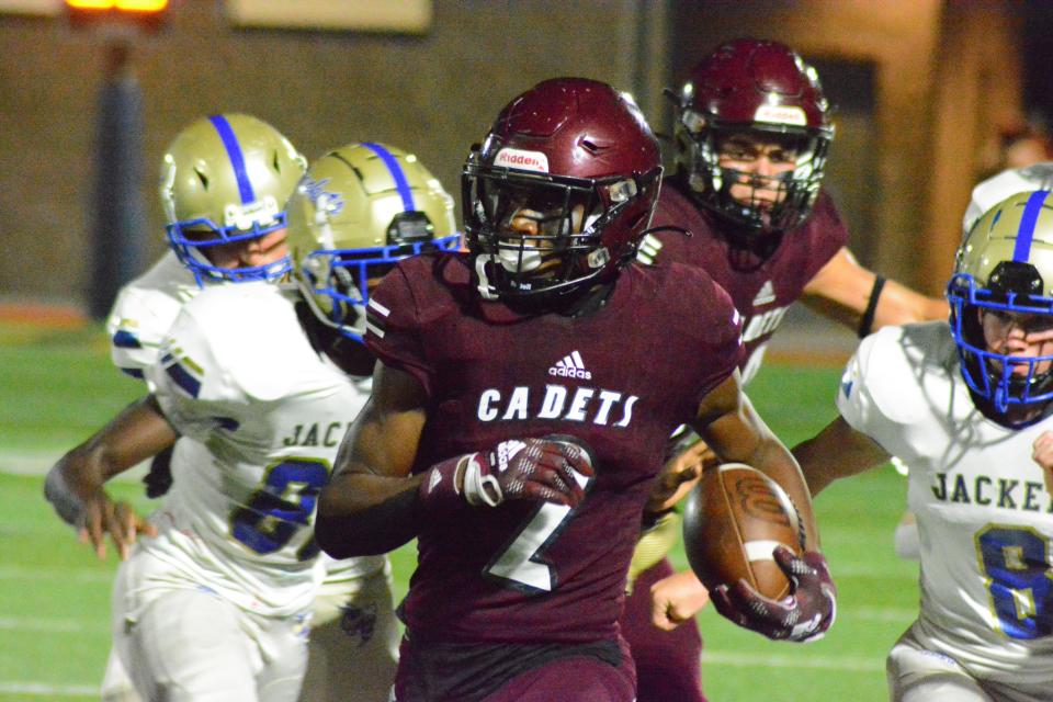 Benedictine wide receiver Thomas Blackshear tries to beat Southeast Bulloch defenders down the sideline during Friday night's game.