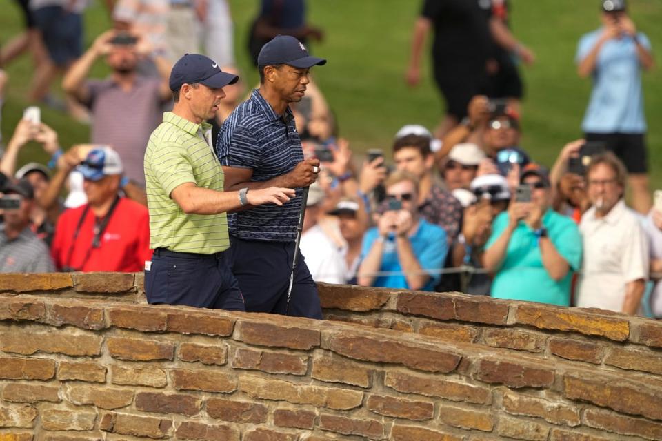 Rory McIlroy headed into the 2nd round of the US PGA Championship nine shots ahead of playing partner Tiger Woods (Matt York/AP) (AP)