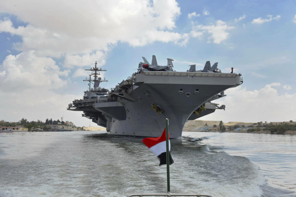 The USS Abraham Lincoln sails south in the Suez canal near Ismailia, Thursday, May 9, 2019. The White House said Wednesday it dispatched the aircraft carrier and B-52 bombers to the Persian Gulf over what it described as a new threat from Iran. (Suez Canal Authority via AP)
