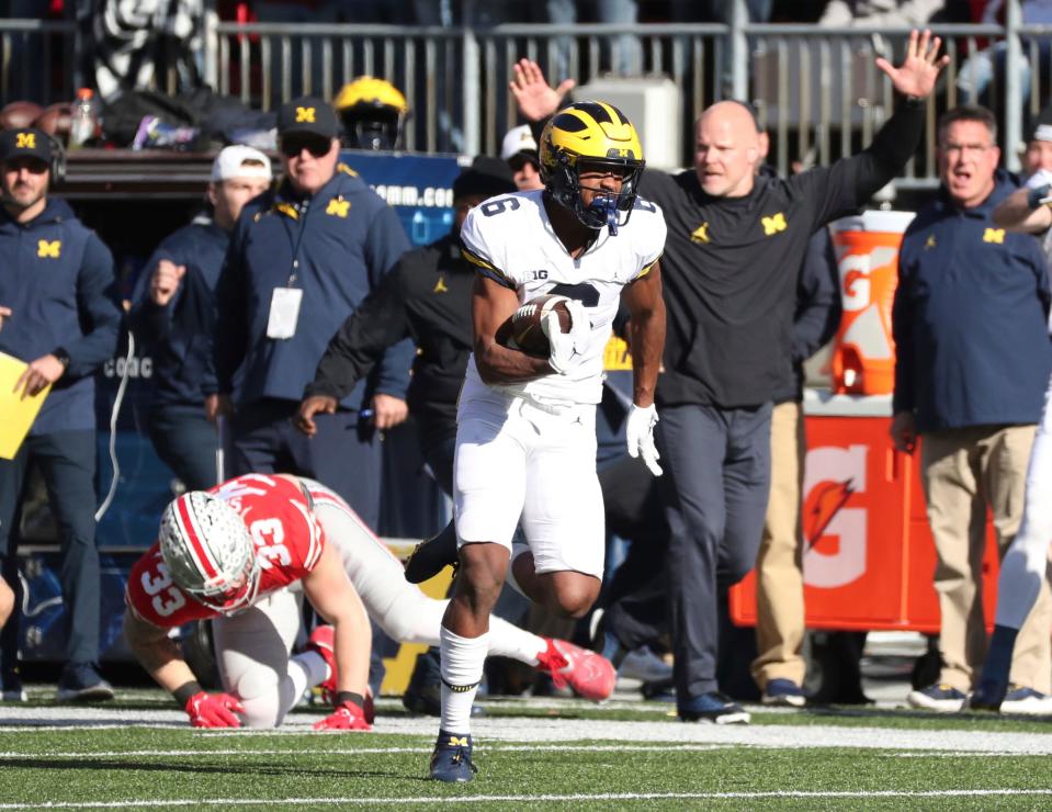 Michigan Wolverines wide receiver Cornelius Johnson (6) catches and runs for his first touchdown against the Ohio State Buckeyes during the first half at Ohio Stadium in Columbus on Nov. 26, 2022.
