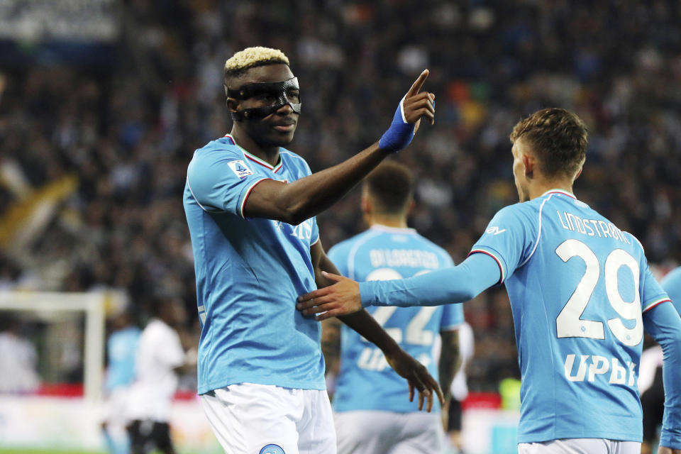 Napoli's Victor Osimhen, left, celebrates with teammates after scoring the opening goal during the Italy Serie A soccer match between Udinese and Napoli at the Bluenergy Stadium in Udine, Italy, Monday, May 6, 2024. (Andrea Bressanutti/LaPresse via AP)