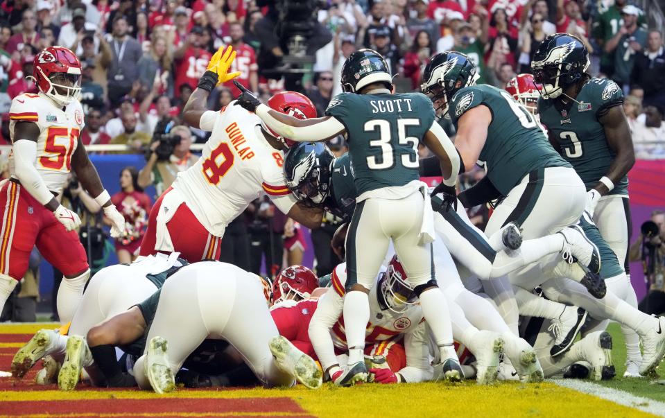 Philadelphia Eagles quarterback Jalen Hurts scores a touchdown on a quarterback sneak against the Kansas City Chiefs during Super Bowl 57.