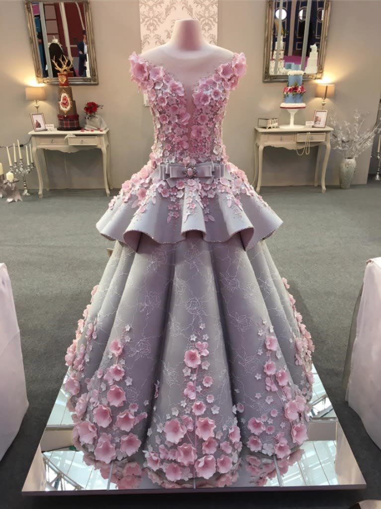 Something borrowed: This incredible creation is actually a cake inspired by a wedding dress – and it’s a dead ringer for the original. (Photo: Courtesy of Facebook.com/WeddingsCI)