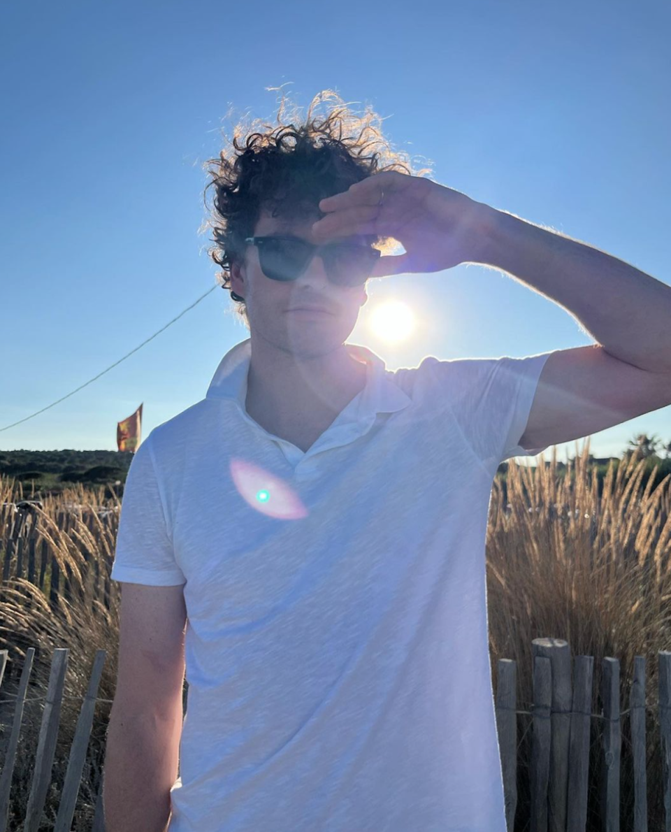 Vance Joy white shirt sunglasses 