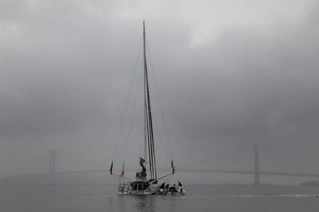 Swedish 16-year-old activist Greta Thunberg stands on the Malizia II racing yacht in New York Harbor as she nears the completion of her trans-Atlantic crossing in order to attend a United Nations summit on climate change in New York