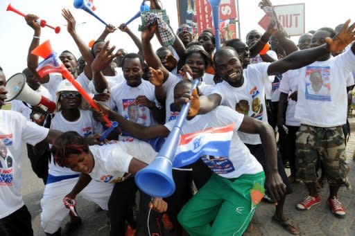 Supporters of Nana Akufo-Addo dance in Kasoa, central Ghana, on Saturday. The opposition presidential candidate has sparked debate with a proposal to abolish fees at senior high schools which can amount to several hundred dollars per term and can keep education out of reach for many families