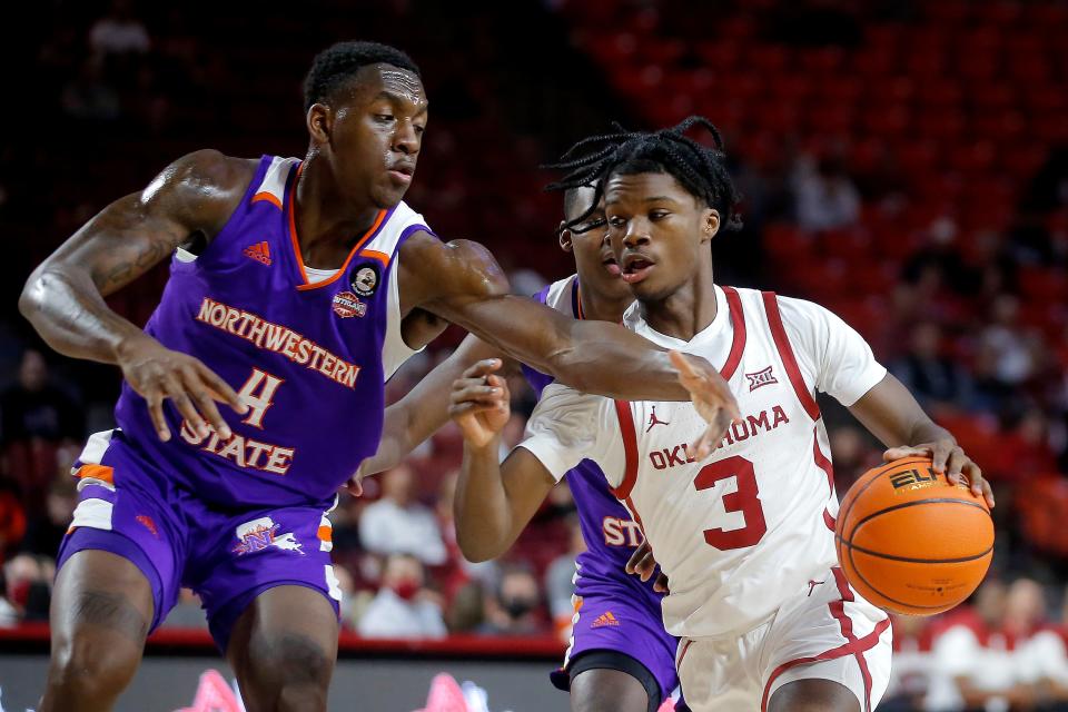 Oklahoma's Alston Mason (3) tries to get past Northwestern State's Kendal Coleman (4) during an NCAA college basketball game between the University of Oklahoma (OU) and Northwestern State at Lloyd Noble Center in Norman, Okla., Tuesday, Nov. 9, 2021. 