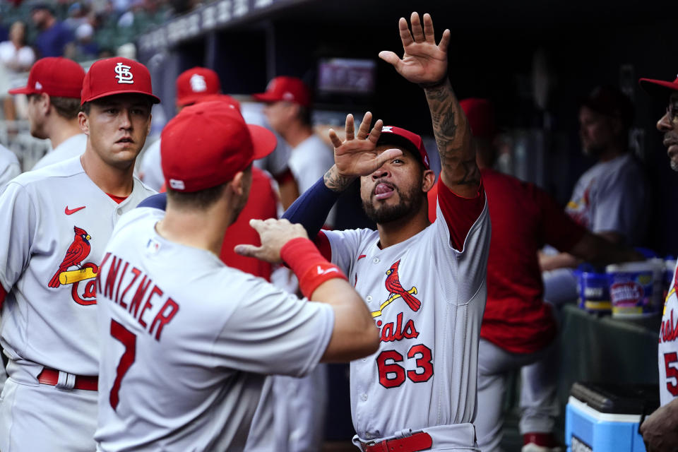 St. Louis Cardinals shortstop Edmundo Sosa (63) and St. Louis Cardinals catcher Andrew Knizner (7) stand in the dugout before the team's baseball game against the Atlanta Braves, Tuesday, July 5, 2022, in Atlanta. (AP Photo/Brynn Anderson)