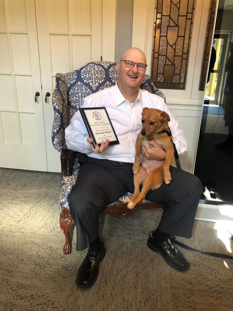Ty Dierkes was presented with the Paw-sitive Partner award for his service with The Animal Shelter Society. Dierkes served on the board for almost three years, and the board room will be dedicated to him, including a plaque by the door.