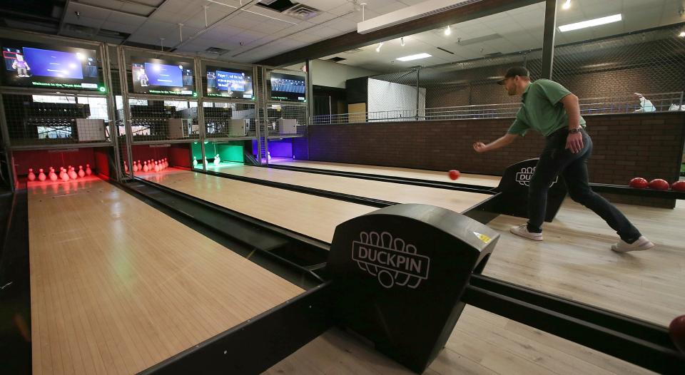 Inside Golf co-owner Mike Schmid shows the new bowling extension of the store at North Grand mall Wednesday, March 29, 2023, in Ames, Iowa.