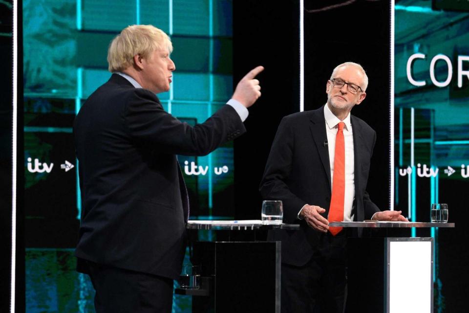 Point made: Boris Johnson and Jeremy Corbyn duel in the ITV election debate (AFP via Getty Images)