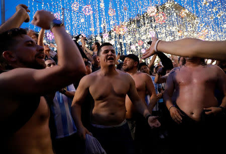 Supporters of the Argentine national soccer team cheer during a gathering in central Moscow, Russia June 18, 2018. REUTERS/Tatyana Makeyeva