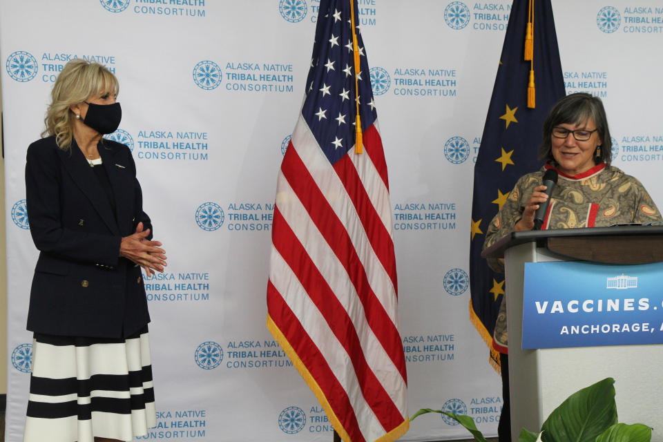 Val Davidson, right, the president of the Alaska Native Health Tribal Health Consortium, introduces first lady Jill Biden, left, during a visit Wednesday, July 21, 2021, to the consortium office in Anchorage, Alaska. Biden stopped in Alaska's largest city as she traveled to Tokyo, her first solo international trip as first lady, leading a U.S. delegation to the Olympic Games. (AP Photo/Mark Thiessen)