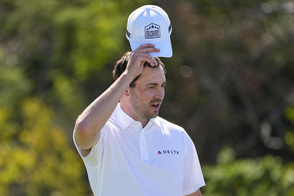 Patrick Cantlay tips his cap with the First Responders Children's Foundation logo during the pro-am round of The Sentry golf event,, Wednesday, Jan. 3, 2024, at Kapalua Plantation Course in Kapalua, Hawaii. (AP Photo/Matt York)