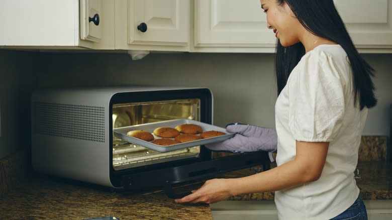 Woman baking toaster oven