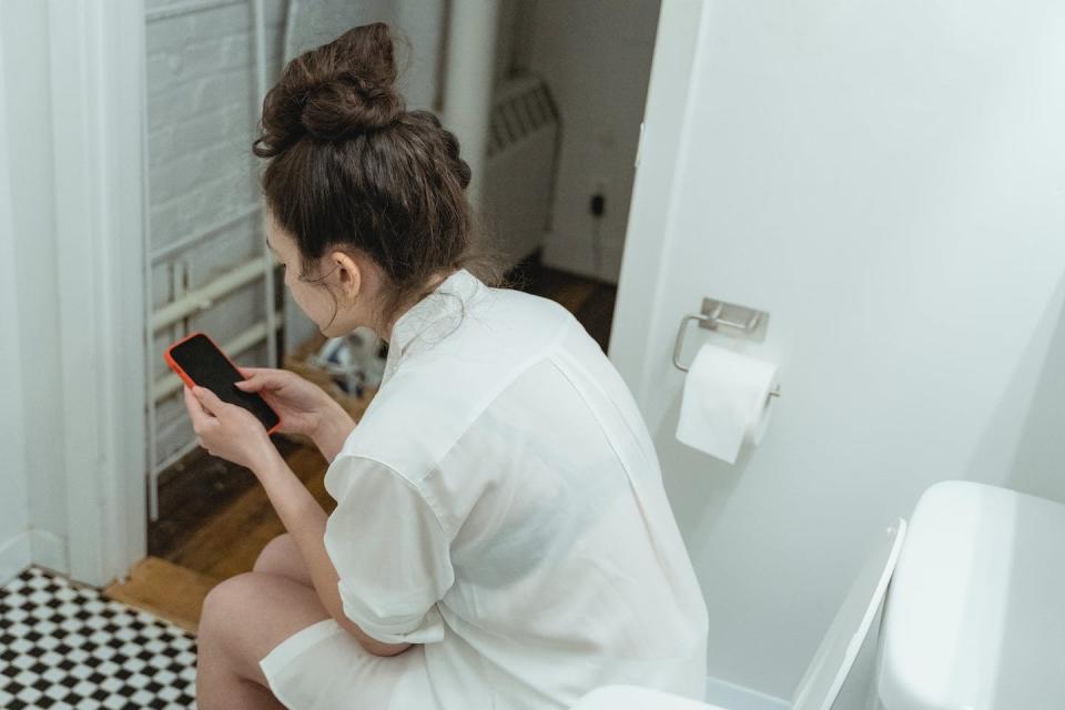 Some people experience disturbances in their bowel habits leading up to their period. <a href="https://www.pexels.com/photo/a-woman-using-her-cellphone-while-in-the-toilet-7623575/" rel="nofollow noopener" target="_blank" data-ylk="slk:Photo by Miriam Alonso/Pexels;elm:context_link;itc:0" class="link ">Photo by Miriam Alonso/Pexels</a>, <a href="http://creativecommons.org/licenses/by/4.0/" rel="nofollow noopener" target="_blank" data-ylk="slk:CC BY;elm:context_link;itc:0" class="link ">CC BY</a>