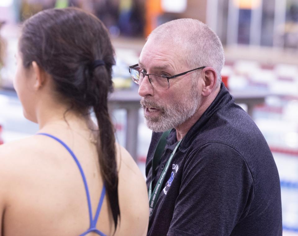 Diving coach Phil Barr chats with GlenOak's Maya Bautista during the 2024 OHSAA girls Division I state diving championships at C.T. Branin Natatorium, Wednesday, Feb. 21, 2024.