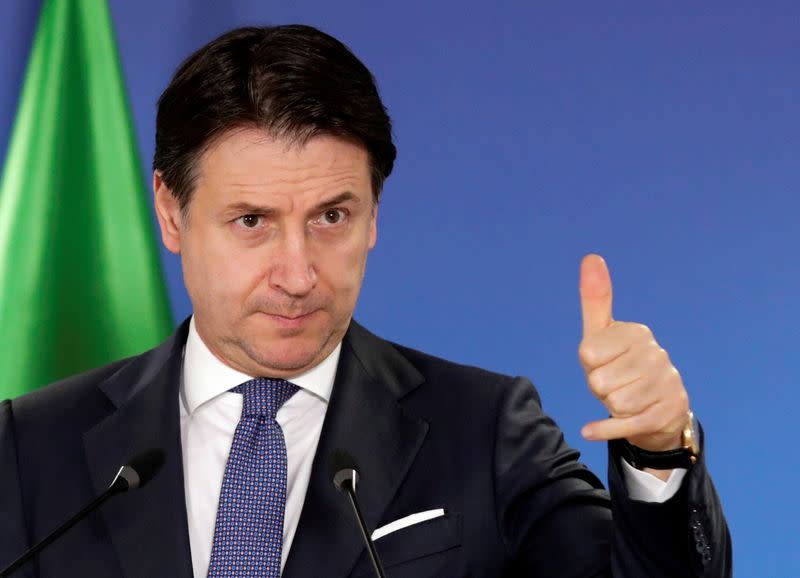 FILE PHOTO: Italian Prime Minister Giuseppe Conte holds a news conference at the end of an EU summit in Brussels