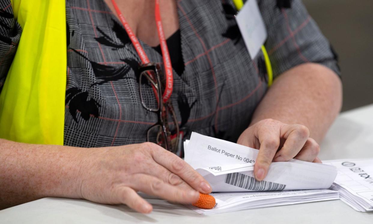 <span>Postal votes being counted in the UK’s 2019 general election</span><span>Photograph: Lesley Martin/PA</span>