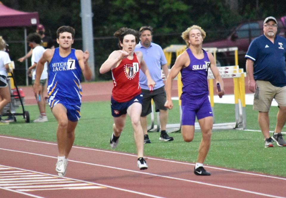 BNL's Zane Thompson (center) duels with Mitchell's Nate Reynolds (left) toward the finish line at the end of the 1,600-meter relay at the Bloomington North Regional last year. Thompson will return to regional this year after winning the 300 hurdles Thursday at the BNL Track & Field Sectional.