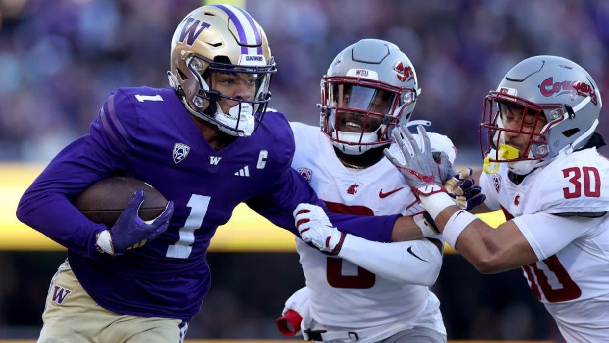 <div>SEATTLE, WASHINGTON - NOVEMBER 25: Rome Odunze #1 of the Washington Huskies catches the ball against Cam Lampkin #3 of the Washington State Cougars and Jackson Lataimua #30 of the Washington State Cougars during the first quarter at Husky Stadium on November 25, 2023 in Seattle, Washington. (Photo by Steph Chambers/Getty Images)</div>