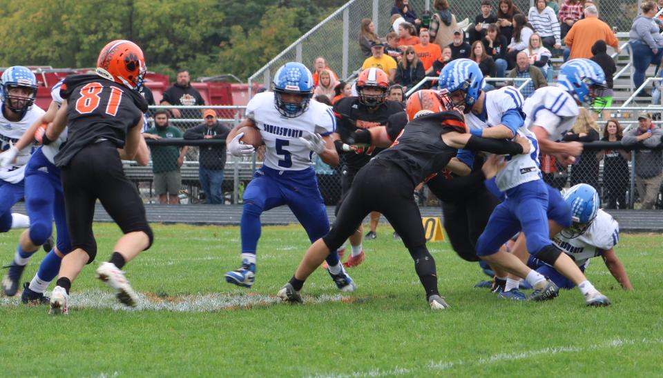 Somersworth's Teyshawn Shepard looks for an opening to the right of Newport's Aidan Couitt in the second quarter.