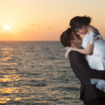 Newly-Wed Couple Hugging in Front of Sea