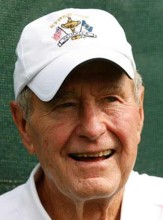 FILE PHOTO - Former U.S. President George H.W. Bush watches four-ball play in 37th Ryder Cup Championship at the Valhalla Golf Club in Louisville, Kentucky in this September 19, 2008 file photo. REUTERS/Shaun Best/File Photo