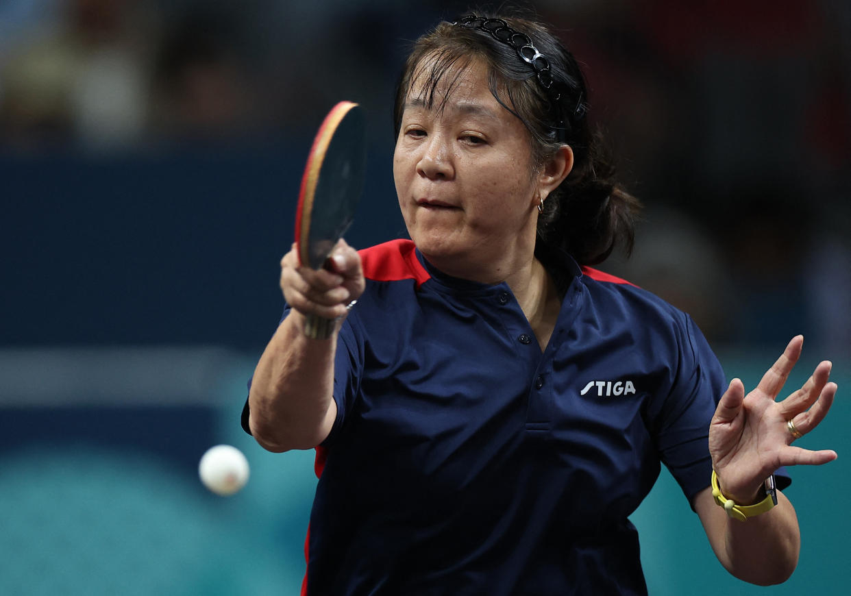 Paris 2024 Olympics - Table Tennis - Women's Singles Preliminary Rnd - South Paris Arena 4, Paris, France - July 27, 2024. Zhiying Zeng of Chile in action with Mariana Sahakian of Lebanon during their preliminary round match. REUTERS/Kim Hong-Ji