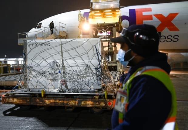 FedEx workers in Toronto offload a plane carrying Moderna vaccine doses originating from Europe in March 2021. 