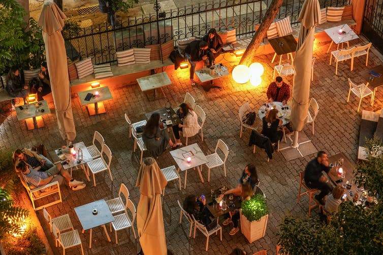 <span class="caption">Socially distant dining in Thessaloniki, Greece, May 25 2020.</span> <span class="attribution"><a class="link " href="https://www.shutterstock.com/image-photo/thessaloniki-greece-may-25-2020-night-1741793285" rel="nofollow noopener" target="_blank" data-ylk="slk:Bestravelvideo/Shutterstock;elm:context_link;itc:0;sec:content-canvas">Bestravelvideo/Shutterstock</a></span>