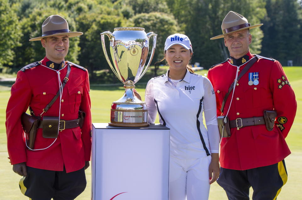 Jin Young Ko of South Korea poses with the trophy after winning the CP Women's Open in Aurora, Ontario, Sunday, Aug. 25, 2019. (Frank Gunn/The Canadian Press via AP)