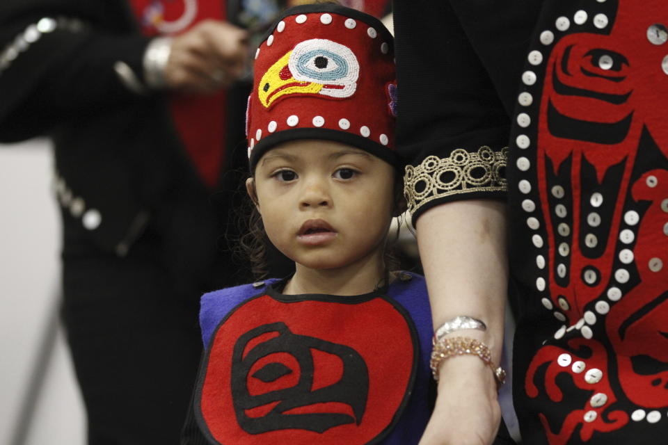 A child member of Aanchich'x Kwann, a Tlingit dance group, performs during the Indigenous Peoples Day celebration Monday, Oct. 9, 2023, in Anchorage, Alaska. (AP Photo/Mark Thiessen)