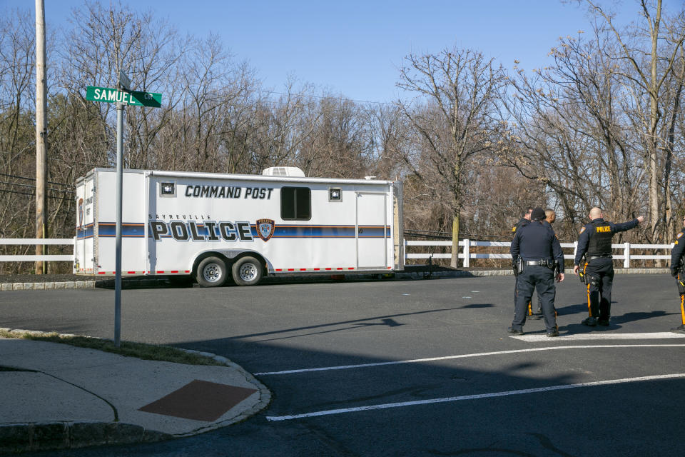 A police command center sits at the scene where a young mother who served on her borough council was found shot to death in an SUV parked outside her suburban home on Thursday, Feb. 2, 2023, in Sayreville, N.J. The Middlesex County prosecutor's office says 30-year-old Sayreville Councilwoman Eunice Dwumfour was found in the vehicle Wednesday evening. (AP Photo/Ted Shaffrey)