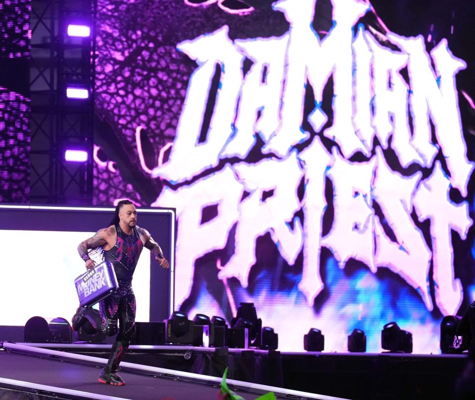 Damian Priest cashes in his Money in the Bank briefcase after the World Heavyweight Championship match between Seth Rollins and Drew McIntyre during Wrestlemania XL Sunday at Lincoln Financial Field.