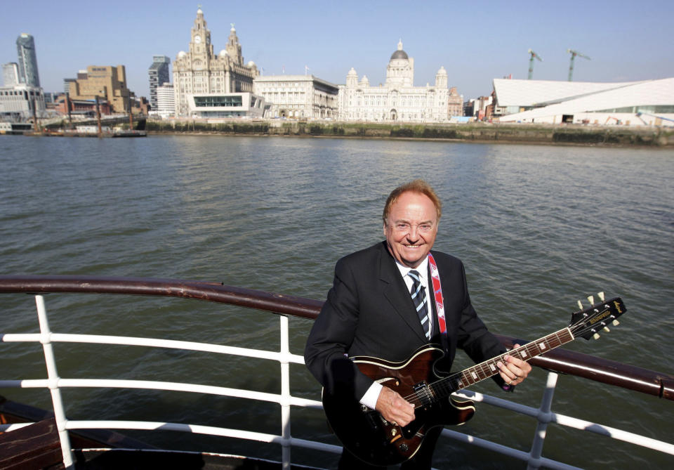 FILE - This April 20, 2009 file photo shows Gerry Marsden on board the Mersey ferry. Gerry Marsden, the British singer and lead singer of Gerry and the Pacemakers, who was instrumental in turning a song from the Rodgers and Hammerstein musical “Carousel” into one of the great anthems in the world of football, has died. He was 78. (Dave Thompson/PA via AP, File)