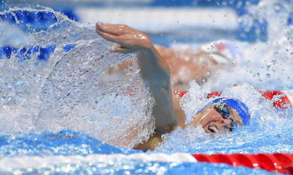 FILE - In this June 28, 2016 file photo, Elizabeth Beisel competes in the women's 200-meter freestyle preliminaries at the U.S. Olympic swimming trials in Omaha, Neb. Beisel competed in three Olympics, but she's never taken on a challenge quite like this. Honoring her late father and raising money for cancer research, she's planning to swim more than 12 miles through cold ocean waters to a popular vacation island off the Rhode Island coast. (AP Photo/Mark J. Terrill, File)