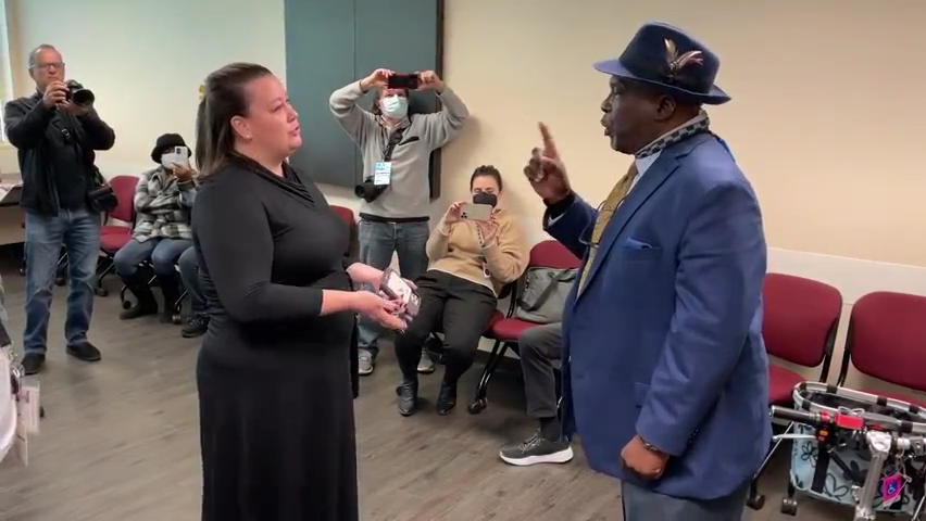 Northside Coalition President Ben Frazier defends his right to be at Tuesday's scheduled news conference of Gov. Ron DeSantis in Jacksonville. He was soon hauled away in handcuffs.