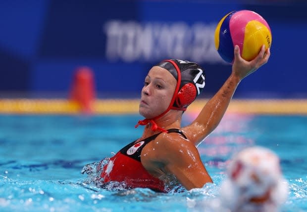 Canada's women's water polo team lost 14-10 to Spain Monday. Winnipeg's Shae la Roche, pictured above, had a pair of goals for Canada in the loss. (Kacper Pempel/Reuters - image credit)