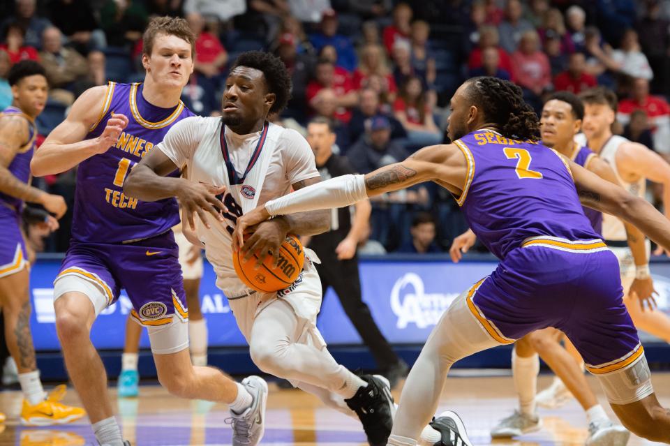 Tennessee Tech’s Jaylen Sebree (2) attempts to steal the ball from Southern Indiana’s Isaiah Swope (1) in the last minutes of the Screaming Eagle’s losing match against the Tennessee Tech Golden Eagles with a final score of 82-71 on Thursday, Feb. 23, 2023.