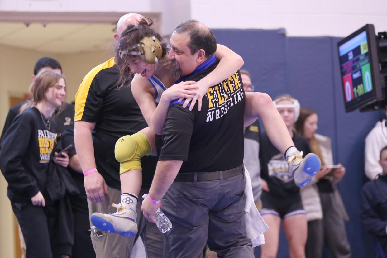 Clyde's Audrey Miracle leaps into coach Dave Stanley's arms as she punches her ticket to next week's state tournament.