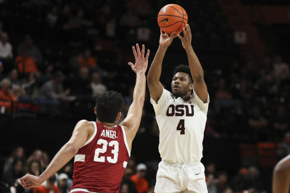 Oregon State guard Dexter Akanno (4) shoots over Stanford forward Brandon Angel (23) during the first half of an NCAA college basketball game in Corvallis, Ore., Thursday, March 2, 2023. (AP Photo/Amanda Loman)